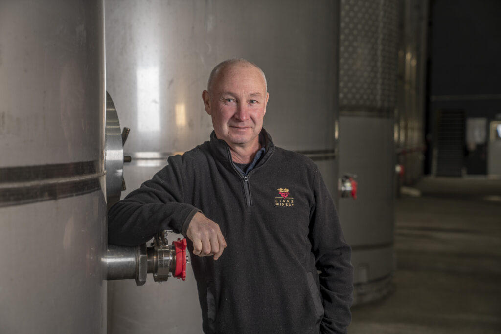 Links Winery staff member beside stainless-steel tanks in the Hawke’s Bay contract wine making facility.
