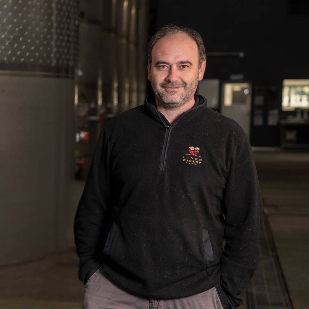 Staff member inside Links Winery’s stainless-steel tank room, part of their Hawke’s Bay contract wine making operation.